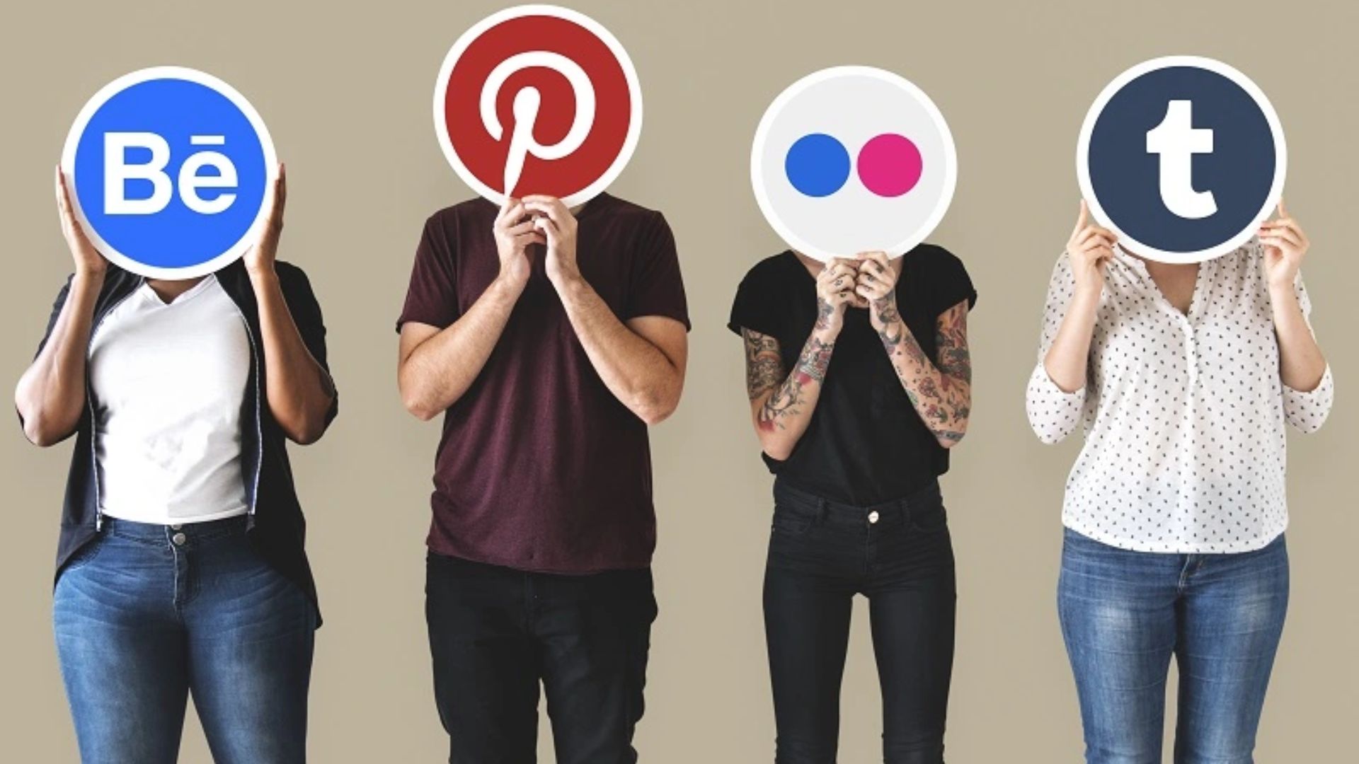 people holding social media icon cards